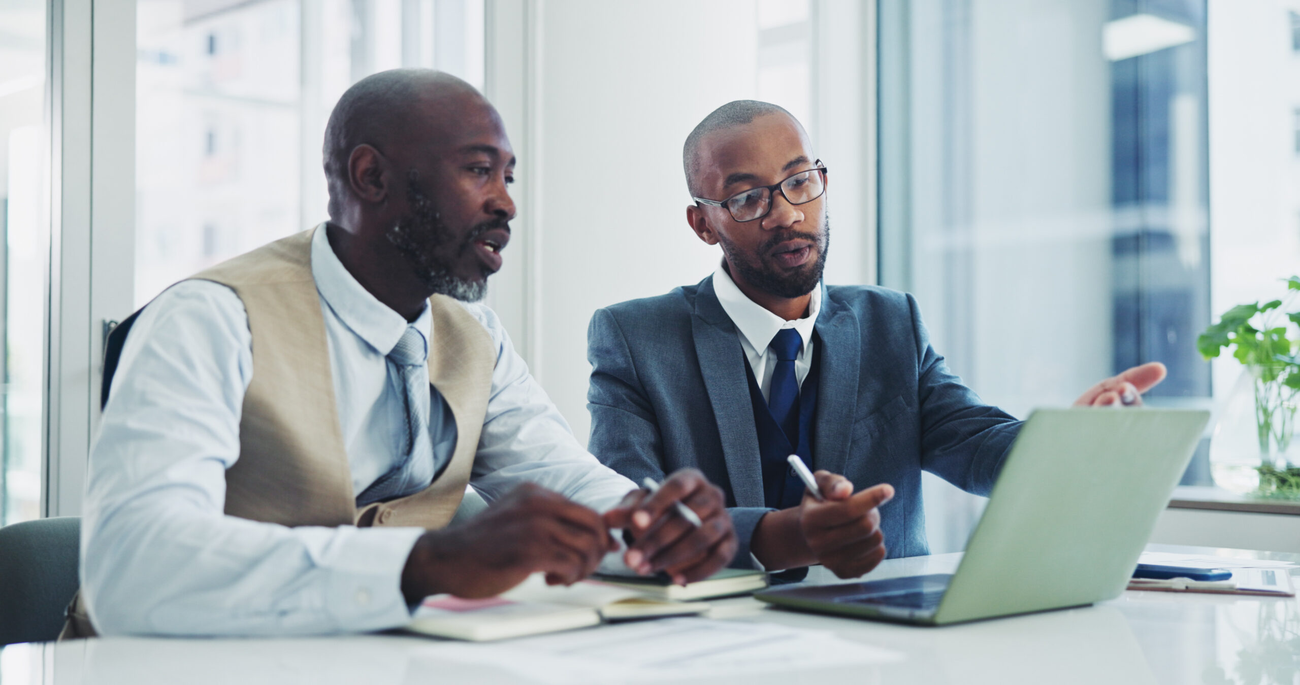 business-black-men-and-laptop-in-office-on-meetin-2026-01-09-11-15-56-utc Business, black men and laptop in office on meeting for ideas on project with teamwork and collabor.